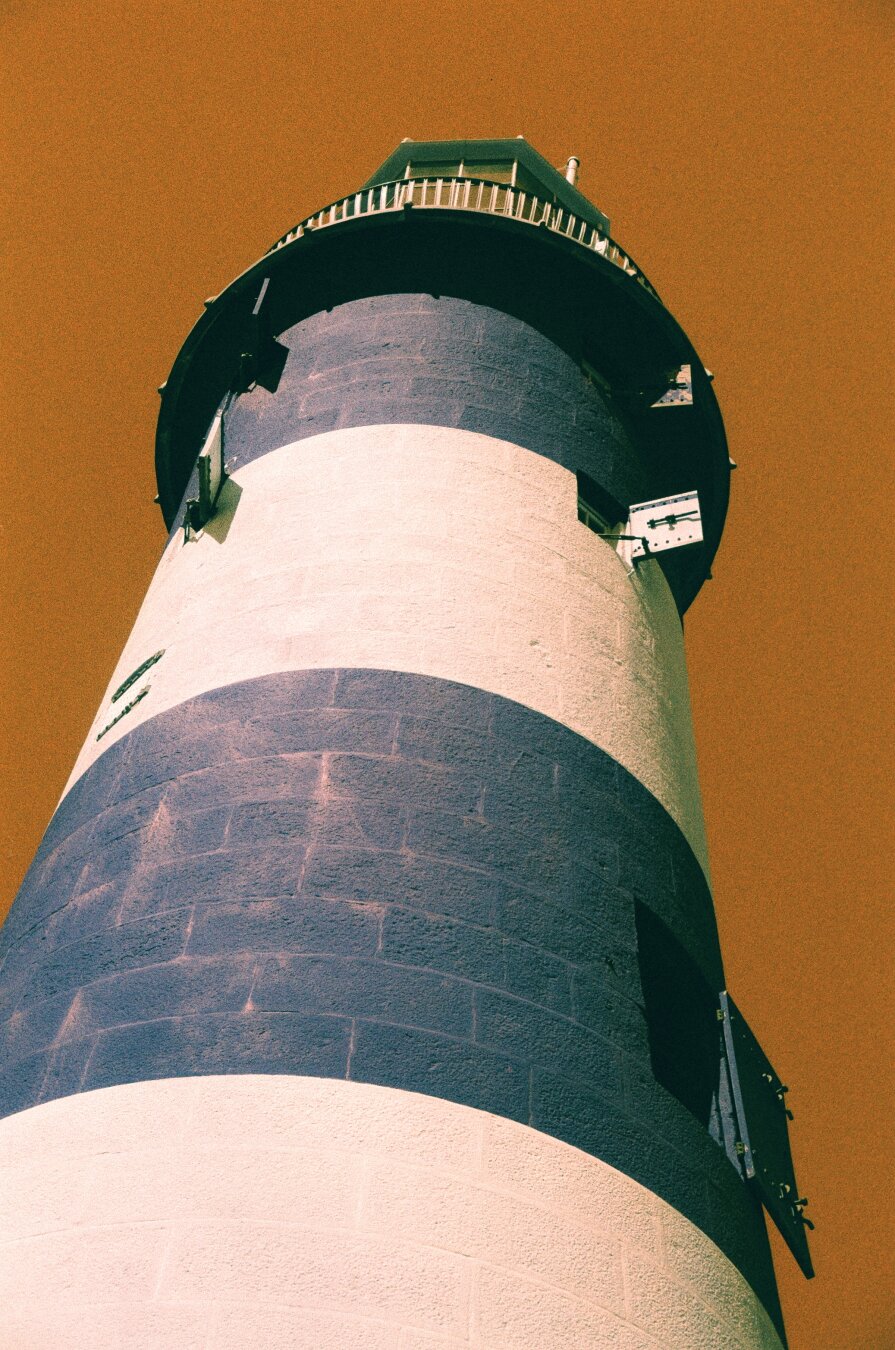 Smeaton's Tower in Plymouth, looking up at its red and white stripes, on Harman Switch Azure film.